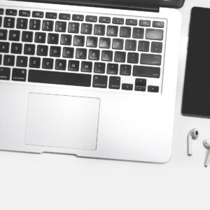 macbook pro on white table keyboard-laptop