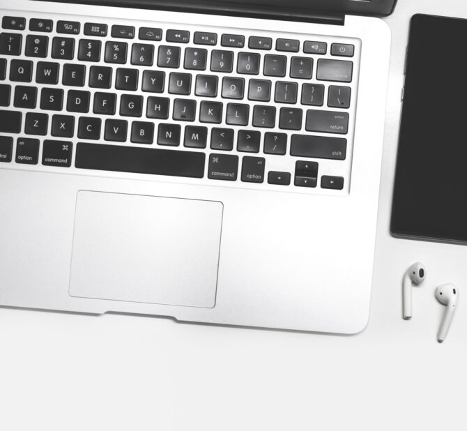 macbook pro on white table keyboard-laptop